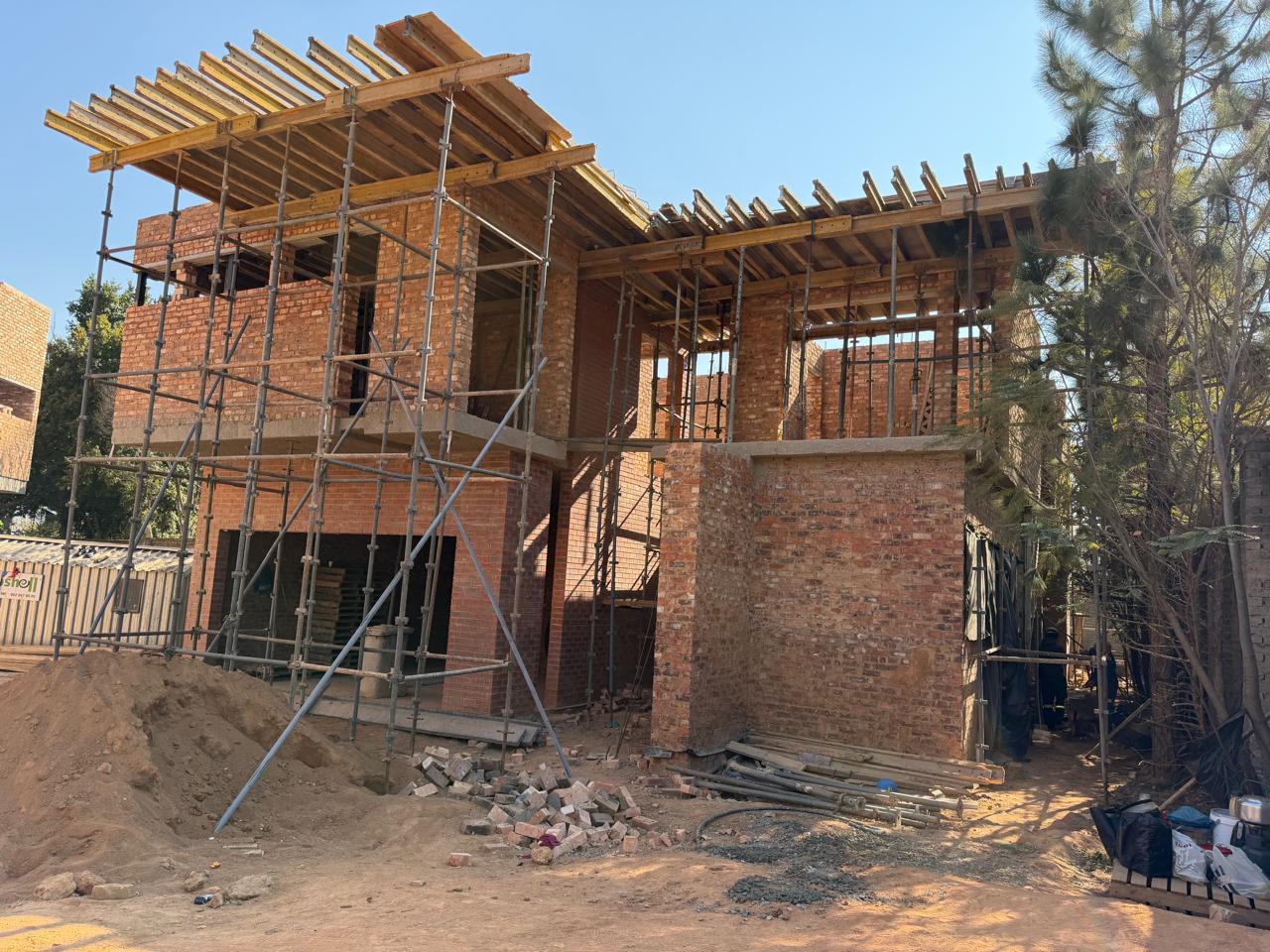 Mount Reserve under construction, upper floor brickwork advancing with scaffolding in place around the elevations