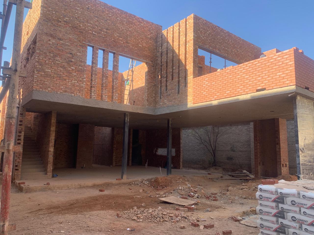 Mount Reserve under construction, ground floor structure taking shape with roof slab formwork and steel columns in position