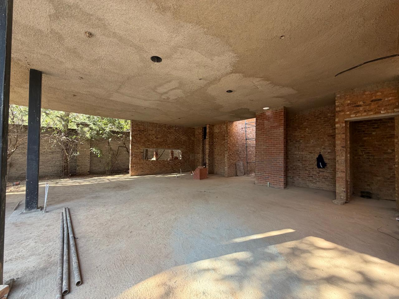 Mount Reserve under construction, covered patio and built-in braai area forming at the rear of the homes